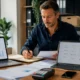British small business owner using essential digital business tools in a modern office.